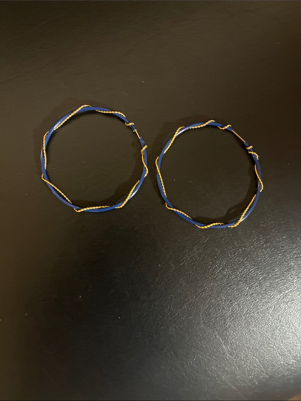Blue hoop earrings with twisted gold wire